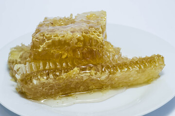 Sweet, fresh honey in a honeycomb. cropped frame