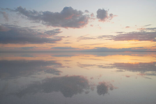Lake Elton, tranquility scene with mirrored warm tone cloudscape
