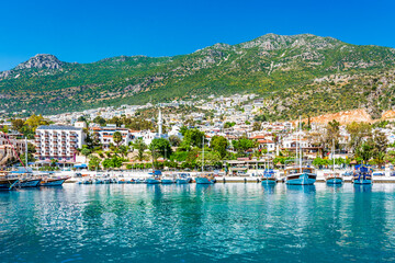 Kalkan Marina view from sea. Kalkan is a town on the Turkish Mediterranean coast, and an important tourist destination. - obrazy, fototapety, plakaty