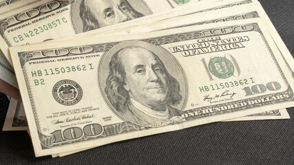 One hundred American dollar bills. dollars banknotes. 100 American dollars. Franklin. paper money,...