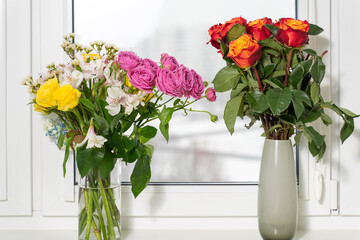Beautiful flowers in vase with light from window