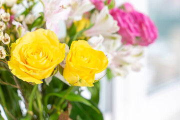 bouquet of flowers near the window. Close-up with space for the label.