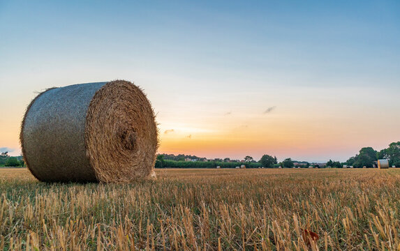 Rural village with straw bales at sunset on the Mediterranean coast