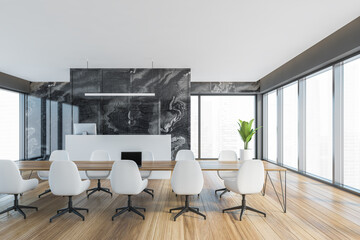 Empty office conference meeting room with reception desk computer and marbel wall, wooden parquet. Panoramic windows. City view.