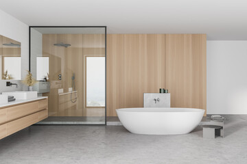 Fototapeta na wymiar Interior of stylish bathroom with wooden walls, concrete floor, comfortable bathtub, double sink with horizontal mirror and shower stall.