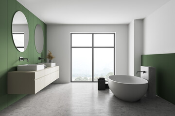 Obraz na płótnie Canvas White and green bathroom with white bathtub, mirrors and marble floor