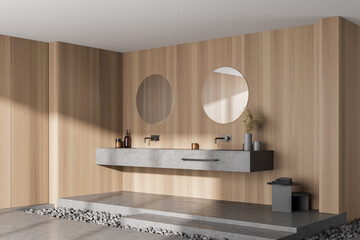 Light wooden bathroom with two sinks and mirrors, marble floor