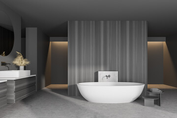 Fototapeta na wymiar Interior of modern bathroom with gray walls, concrete floor, white bathtub and double sink with round mirror on dark gray counter.