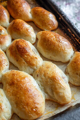 Baked homemade pies on the baking sheet