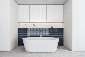 Naklejka na ściany i meble White and blue bathroom with white bathtub on grey marble floor