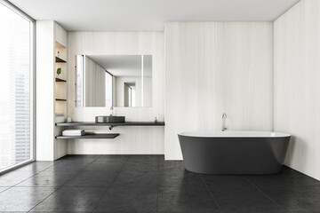 Naklejka na ściany i meble Black and white bathroom with sink and bathtub on black tiled floor
