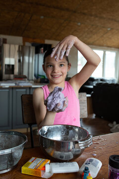 Girl dropping slime into her hand
