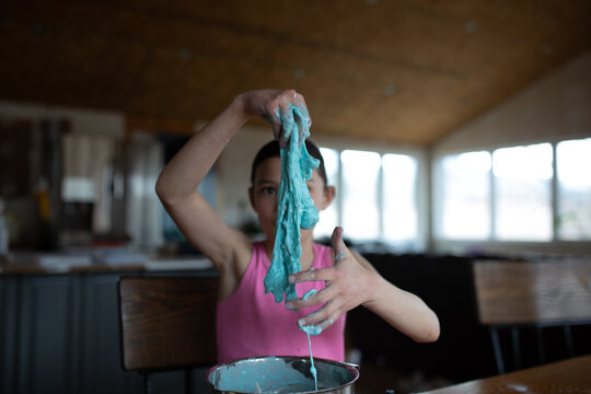 Tween making blue slime at home