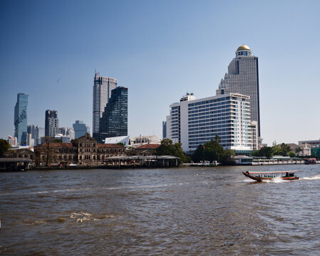 By the Chao Phraya river in Bangkok city - its banks and building around