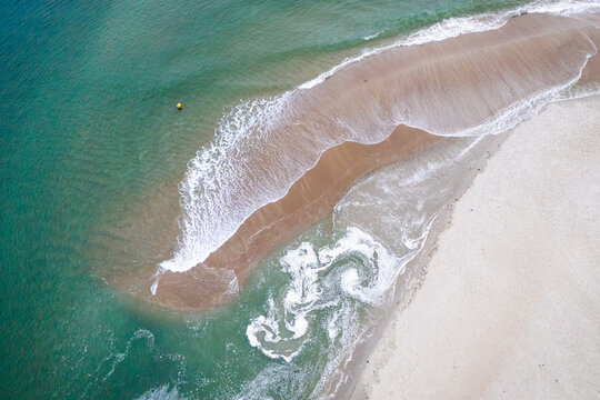 Surfcaster Fisherman at Narragansett Town Beach shot on Aerial Drone