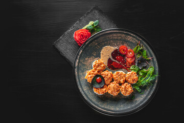 sushi roll in plate on black wooden table background