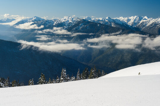 Snowy Mountain Range in Winter With Clouds