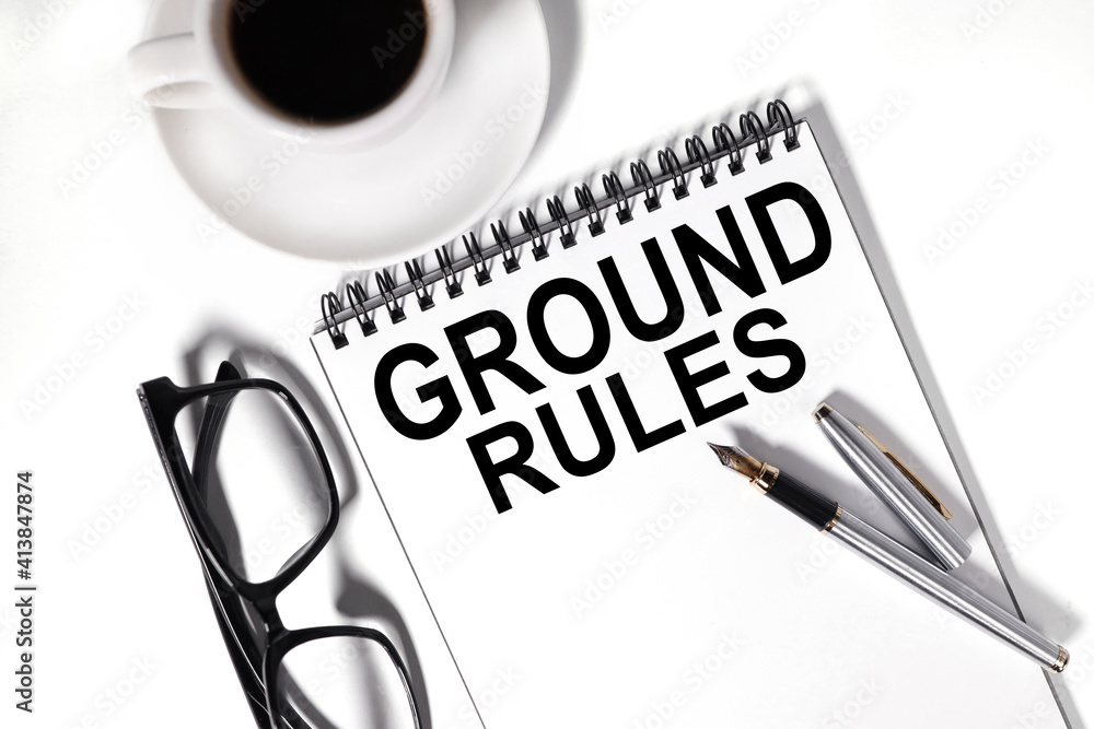 Poster ground rules . text on white notepad paper on white background.
