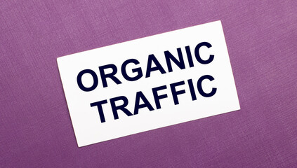 On a lilac background, a white card with the words ORGANIC TRAFFIC