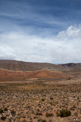 Arid desert background. The colorful canyon, sandstone and rocky mountains under a beautiful sky.