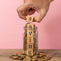 Creative concept saving money with stack of coins.