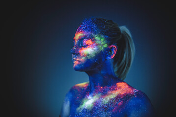 Conceptual shot of light and shine fluorescent colors young girl's fac