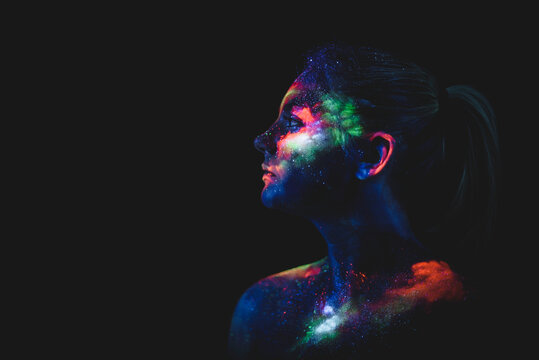 Conceptual shot of light and shine fluorescent colors young girl's fac