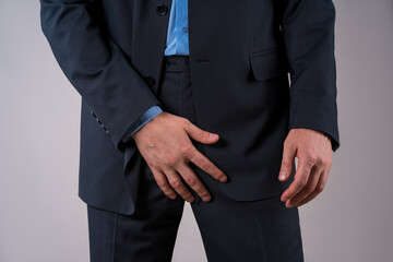Urological genital infections concept, pain in prostate, office worker suffering from prostatitis...