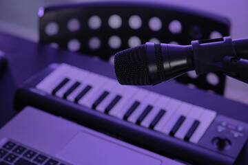 Music recording set with a microphone, piano keyboard and laptop. Internet musician youtuber influencer set.