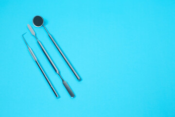 Dental  set instruments on dentistry background.top view