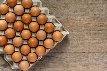 Chicken eggs in a carton. Flat lay.