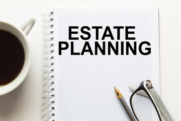 Notepad with inscriptions ESTATE PLANNING on a white background. business concept.