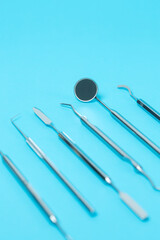 Dental  instruments set on dentistry blue  background. close-up