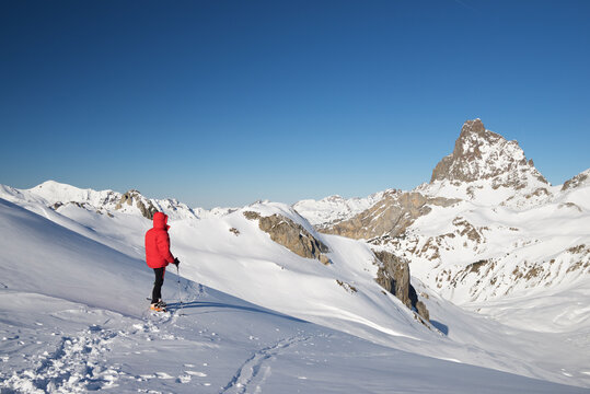 Mountaineer hiking in the Pyrenees in winter season.