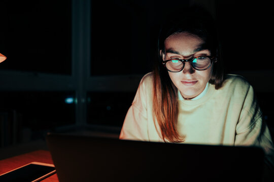 Caucasian Female Student Working Late A Night In Home Office Finishing Assignments Meeting Deadlines