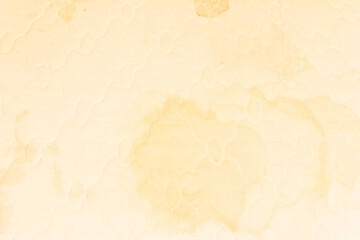 the texture of a white dirty mattress with urine stains