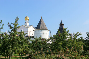 Summer view to famous russian landmark Rostov the great kremlin surrounded by green trees