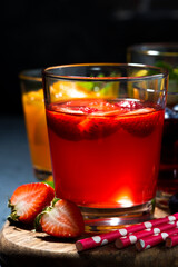 fruit and berry beverages in assortment, vertical closeup