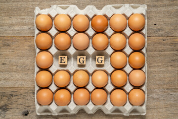 Chicken eggs in a carton. Flat lay.