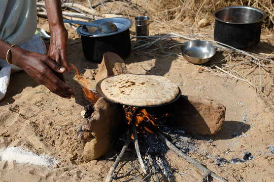 Cooking chapati on an open fire
