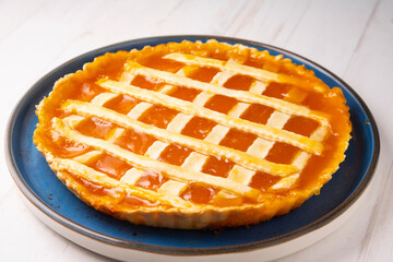 Baked Crostata with peach jam.  Traditional italian recipe.