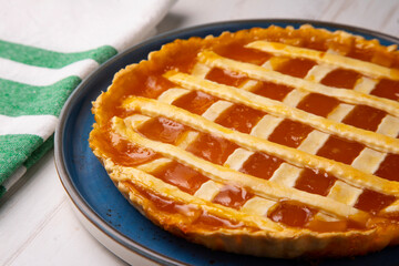 Baked Crostata with peach jam.  Traditional italian recipe.