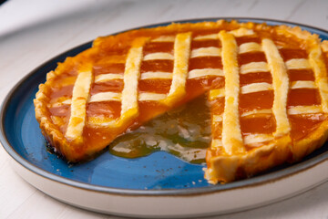 Baked Crostata with peach jam.  Traditional italian recipe.