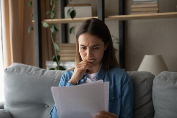 Stressed female student read paper letter with bad news of being expelled from college university...