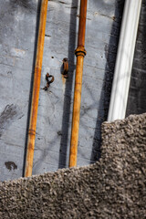 Abstract set up of rusted poles and vents