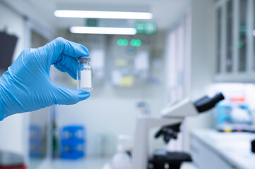 Fototapeta premium Scientists are preparing a vaccine to be placed in sterile boosters for use in patients infected with the pandemic virus.