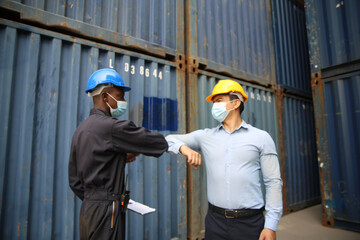 Factory industry worker working with face mask to prevent Covid-19 Coronavirus spreading during job reopening period .