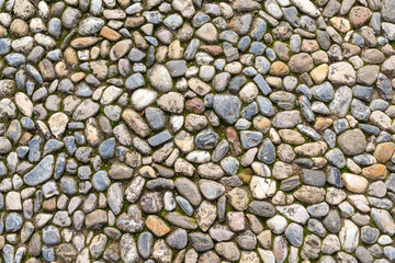 top down view of packed pebble pavement background