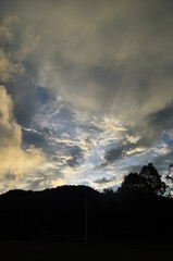 the view of the dark sky and the silhouette of the mountains