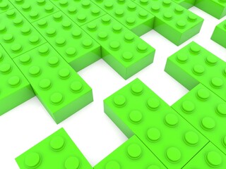 Two parallel piles of green toy bricks